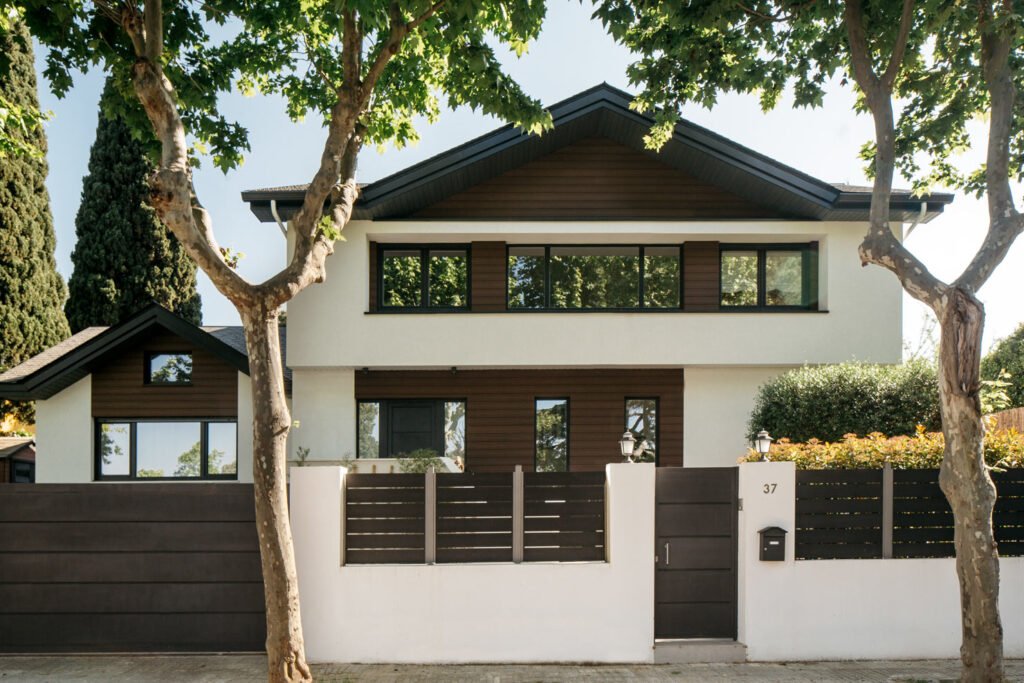 a house with a fence and trees